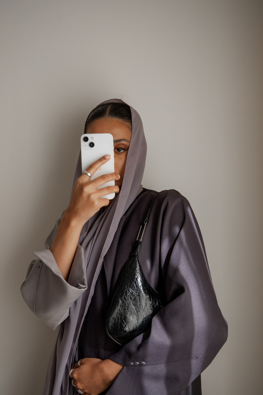 Woman in Hijab and Abaya Taking a Selfie